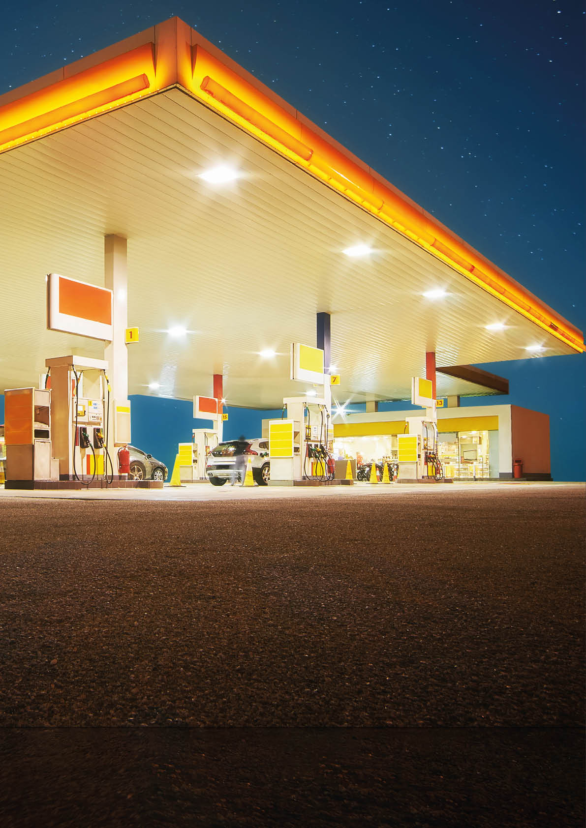 Unbranded Gas station with retail convenience store at night time  