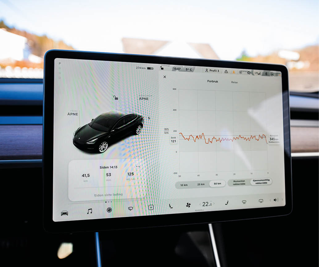 Tønsberg, Norway - march 18, 2021: black Tesla model 3 Long Range Dual motor is an electric car with Scandinavian forest in the background 
