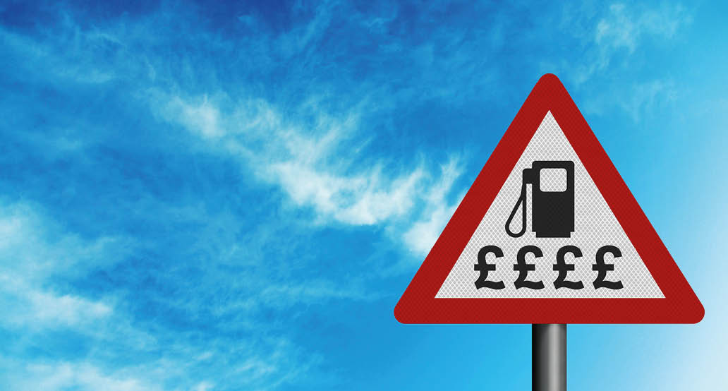 Sky high fuel prices  Photo realistic reflective metallic  sign, against a bright blue sky  With space for your text overlay   editorial