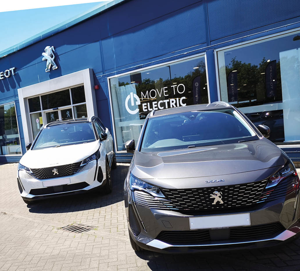 Swansea, UK: June 13, 2021: Peugeot Car Dealership with a new Peugeot 3008 crossover model on display 