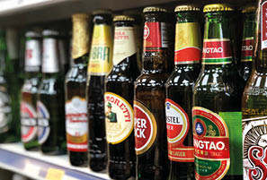 LONDON - 24 JUNE, 2018: A selection of premium lagers on sale on the shelf of an off license in London, UK 