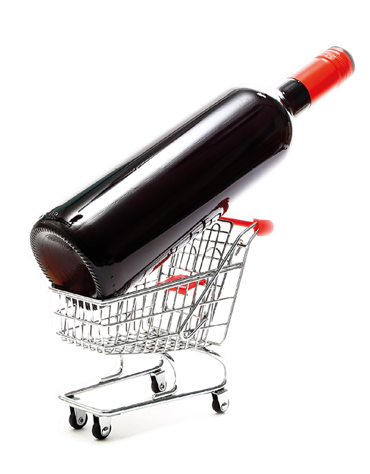 Miniature wire shopping trolley with a bottle of red wine isolated on a white background with copy space