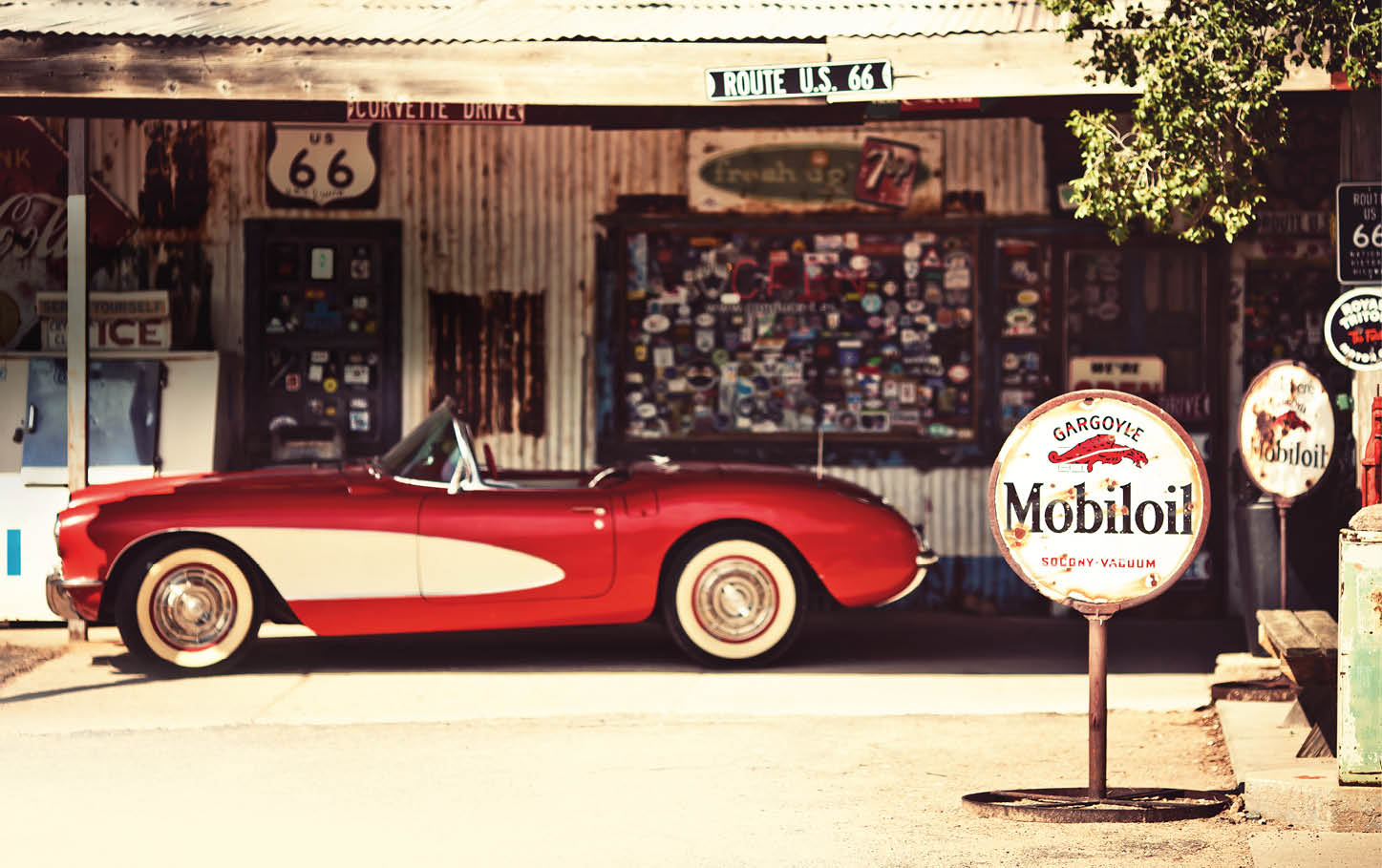 HACKBERRY - AUGUST 3: Hackberry General Store with a 1957 red Corvette car in front on August 3, 2012 in Hackberry , Arizona, USA. Hackberry General Store is a popular museum of old Route 66