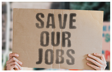 The phrase “ Save our jobs " on a banner in men's hand with blurred background. Unemployment. Wages. Salary. Economical crisis. Crush. Social issues. Problem. Jobless