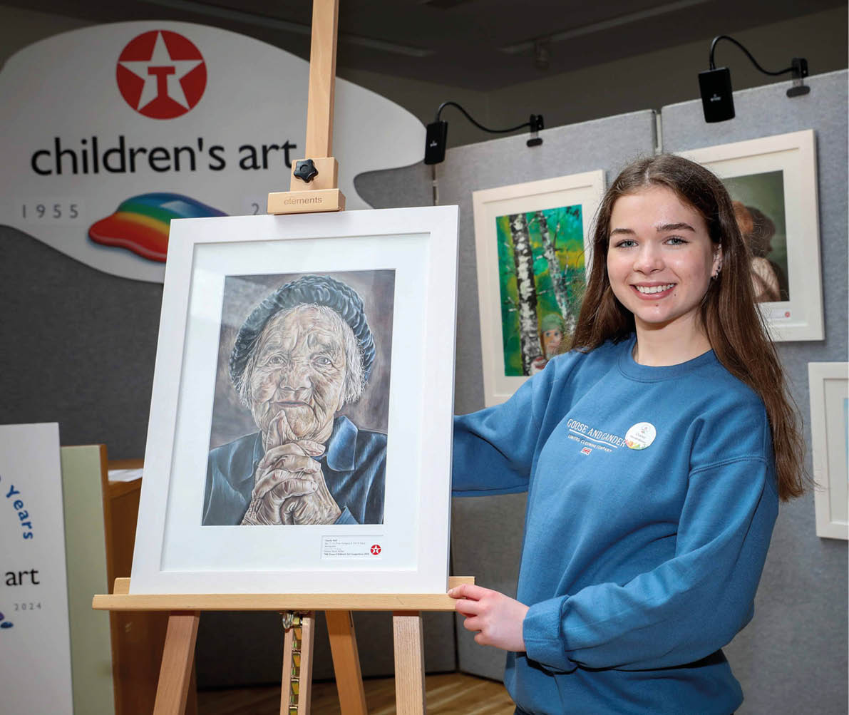 ***FREE TO USE IMAGE - NO REPRODUCTION FEE*** Young Antrim artist, Charley Bell – a 17-year old student from Methodist College Belfast – has been chosen overall winner of this year's 70th Texaco Children's Art Competition, taking first prize in the senior 16-18 years age category for her detailed portrait entitled ‘Anticipation’. Charley is pictured with her prize-winning artwork at a function to announce the top winners held in Dublin. Photo Credit (Mac Innes Photography/Justin Mac Innes)