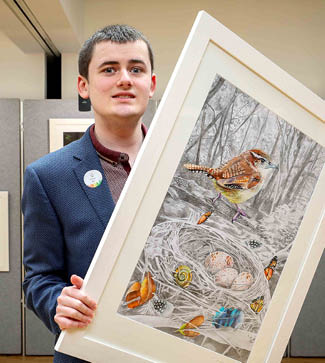 ***FREE TO USE IMAGE - NO REPRODUCTION FEE*** First prize in Category G of the 2024 Texaco Children's Art Competition was won by 18-years old James Moonan, from The Arthouse, Drogheda, for his work entitled ‘The Wren's Nest’. James is pictured with his prize-winning artwork at a function to announce the top winners held in Dublin.  Photo Credit (Mac Innes Photography/Justin Mac Innes)