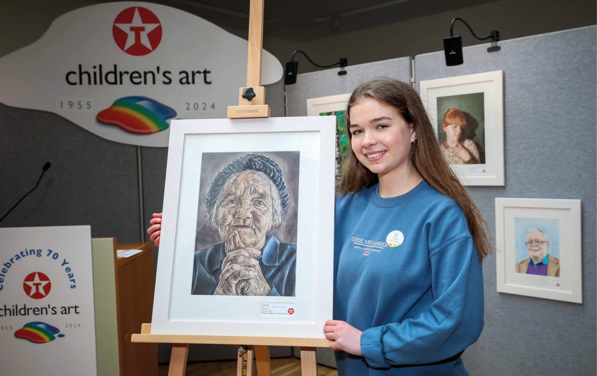 ***FREE TO USE IMAGE - NO REPRODUCTION FEE*** Young Antrim artist, Charley Bell – a 17-year old student from Methodist College Belfast – has been chosen overall winner of this year's 70th Texaco Children's Art Competition, taking first prize in the senior 16-18 years age category for her detailed portrait entitled ‘Anticipation’. Charley is pictured with her prize-winning artwork at a function to announce the top winners held in Dublin. Photo Credit (Mac Innes Photography/Justin Mac Innes)