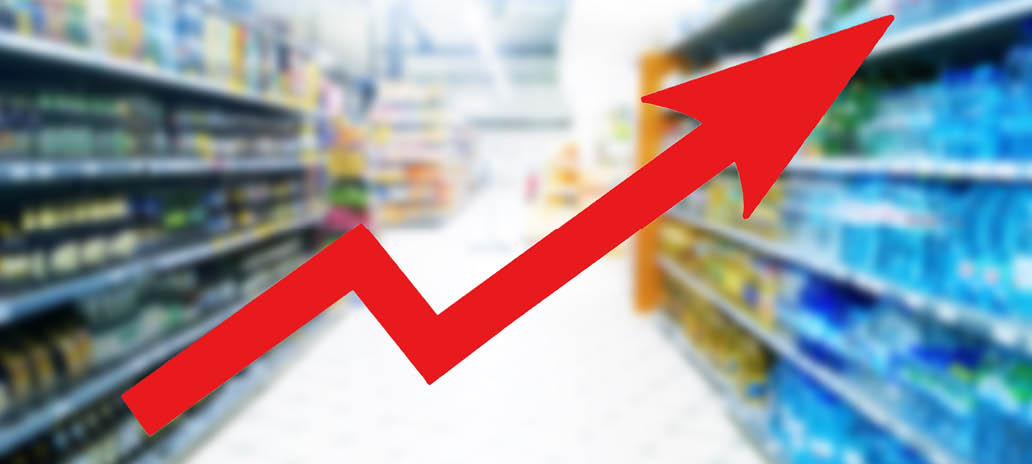 Red growing up large arrow on abstract blur image of supermarket background. Bar charts and graphs. Rising food prices. Inflation concept. Retail industry. Finance and Economy. Stock Market. Store.