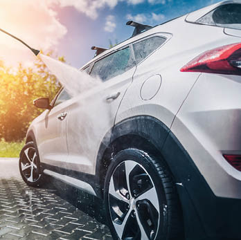 Manual car wash with pressurized water in car wash outside 