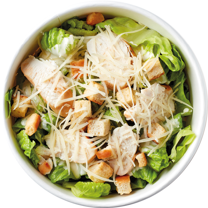 Caesar salad in paper bowl for take away, isolated on white background, top view