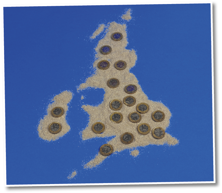 Pounds Coins On A Map Of The United Kingdom Made From Sand  The Cost Of Living In The UK Concept 