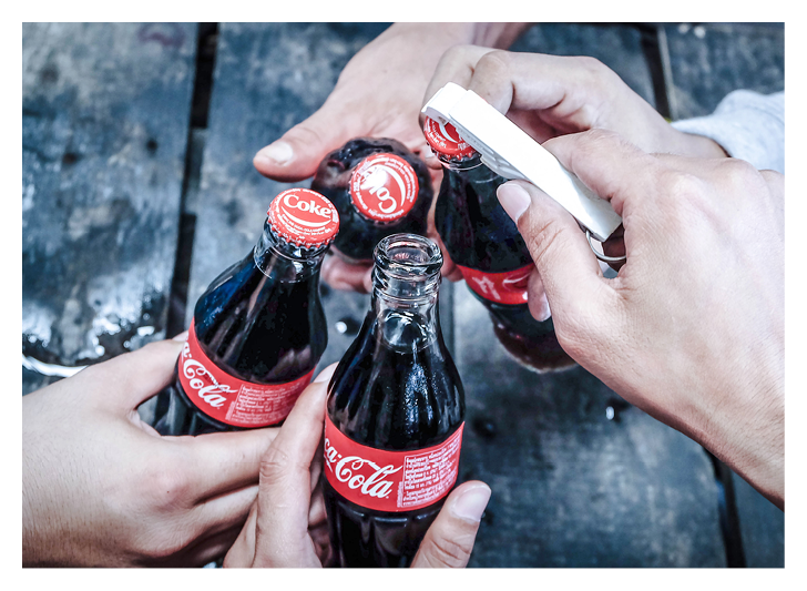 Group of young people drinking coke at a party  Coca Cola bottle Thailand, 5 May 2018