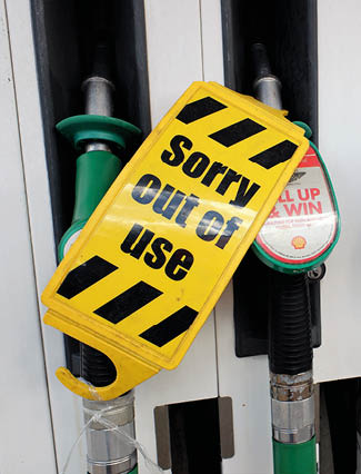 Chorleywood, Hertfordshire, England, UK - September 27th 2021: Sorry out of use signs on petrol pumps at closed filling station during fuel crisis in the UK