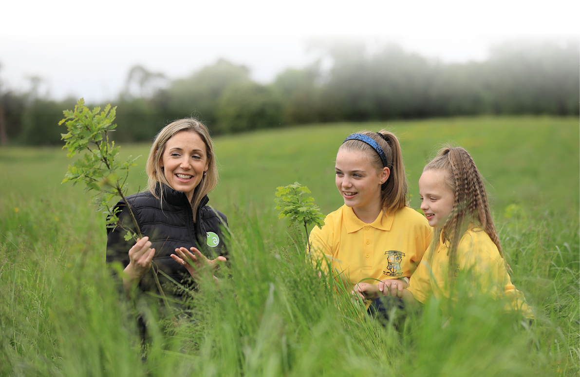 NO FEE PIC PIC JULIEN BEHAL PHOTOGRAPHY Applegreen, Ireland s leading forecourt retailer invited pupils from O Growney National School in Athboy, Co Meath, to a newly-planted native tree forest just outside the town  Applegreen asked the local school children to help with planting the final six birch, ash and oak trees of a colossal 100,000 native trees that are being grown in Counties Westmeath, Leitrim and Galway  Picture shows Fiona Matthews MD Applegreen with local school girls Saoirse and Ella-Mae Mc Auley  Applegreen s forest creation commitment supports the Irish Government s Woodland Environmental Fund (WEF) which is designed to contribute to Ireland s biodiversity and climate change goals   Applegreen is now one of the largest Irish contributors to the WEF programme, having committed to growing 300,000 native Irish trees by the end of 2023   For more information, please contact: Aoife McDonald, Cullen Communications at amcdonald cullencommunications ie or 0874100777  