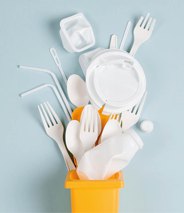 White single use plastic in garbage bin on  blue background  Concept of Recycling plastic  Flat lay, top view