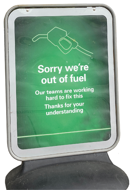 Yeovil, Somerset, England - September 24 2021: BP Petrol station forecourt with Sorry We Are Out of Fuel sign,  due to the lack of HGV drivers