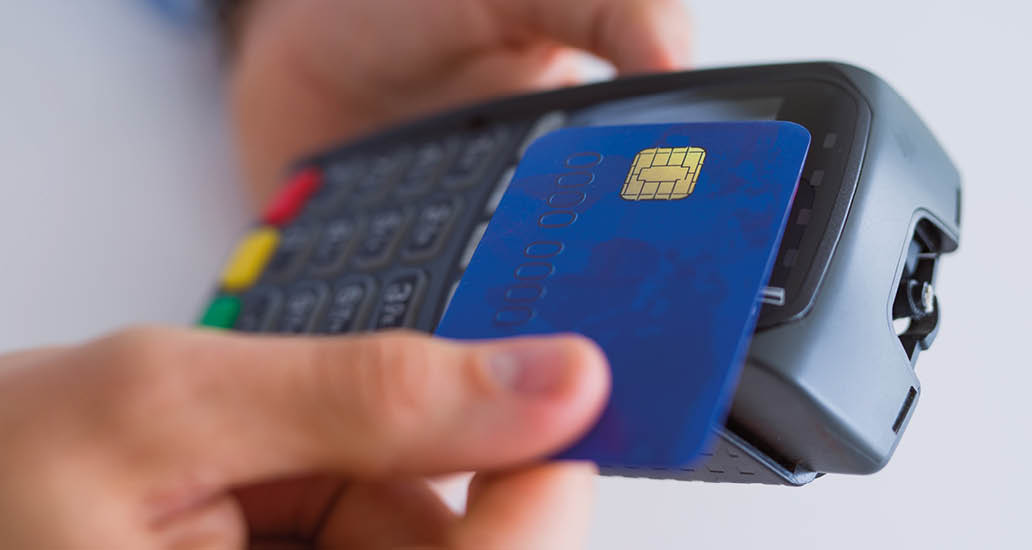 Close up of man hands holding pos terminal