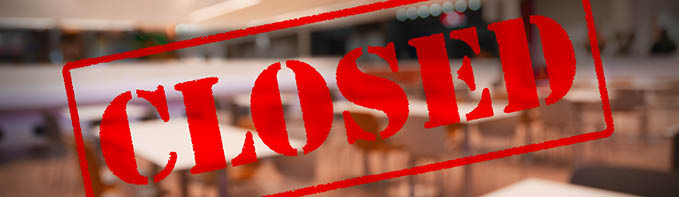 Blurred background with business closed rubber stamp