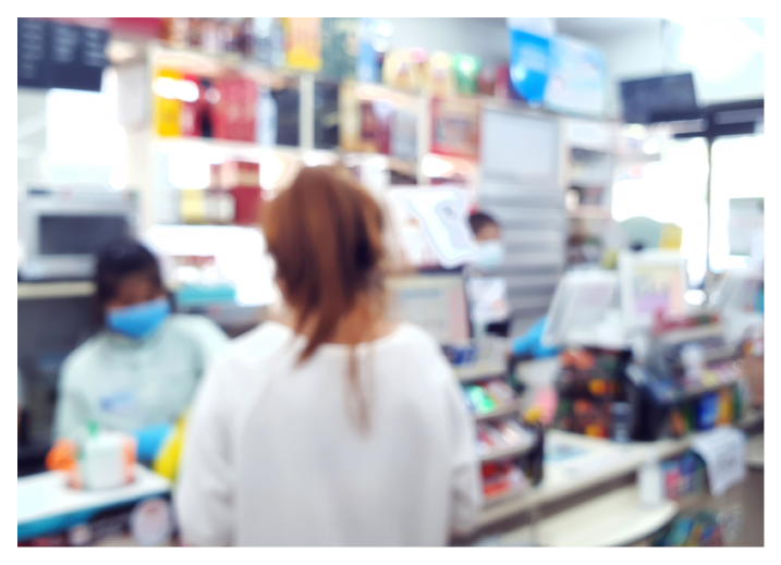 blurry view of people wearing medical mask while working  and shopping in convenience store during covid-19 or coronavirus situation  new normal for lifestyle during epidemic of virus time  