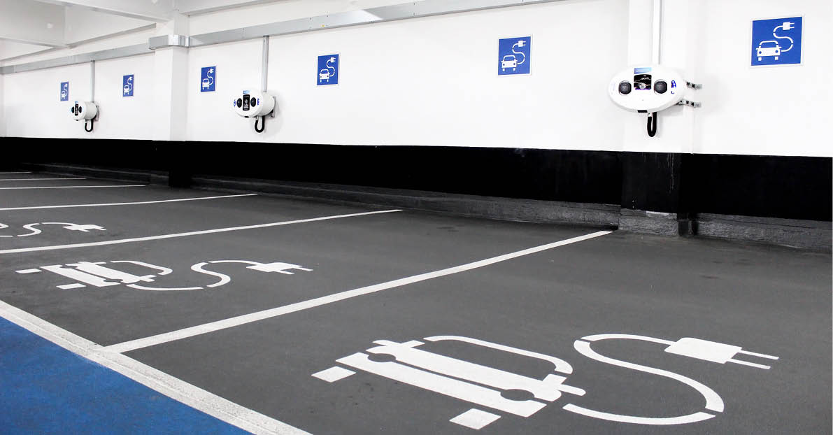 Electric car charging station in indoor parking garage