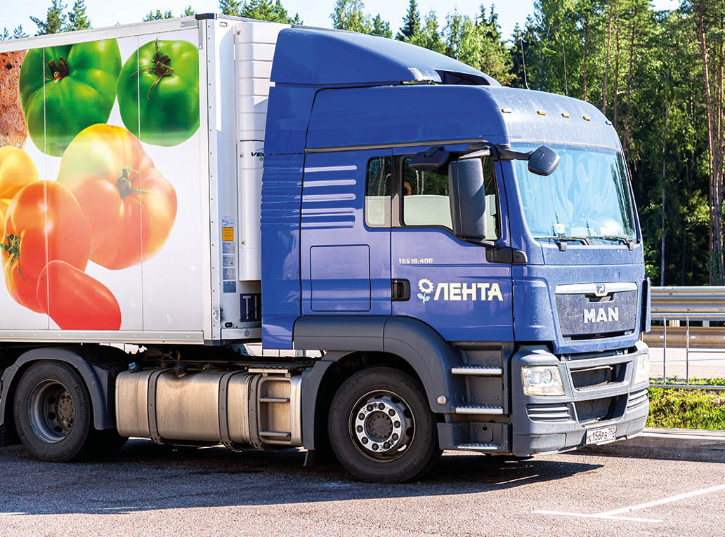 Moscow, Russia - July 6, 2021: MAN truck of grocery Lenta store  Freight delivery truck on a highway