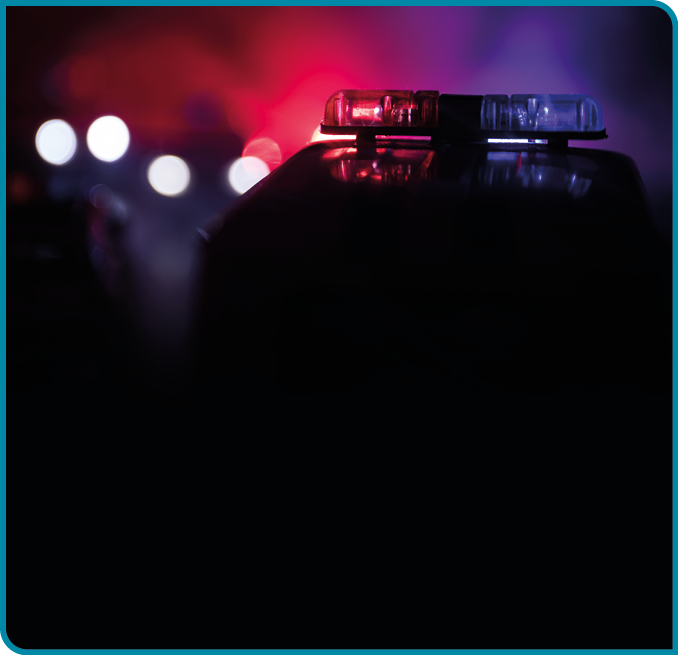 Police cars at night  Police car chasing a car at night with fog background  911 Emergency response police car speeding to scene of crime  Selective focus