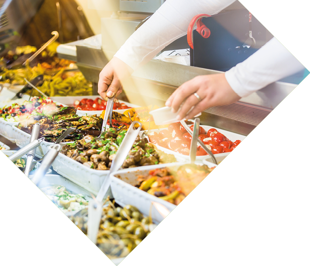 Woman selling Meze appetizers in delicatessen store