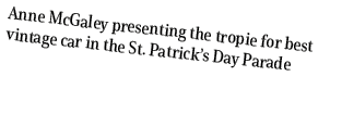 Anne McGaley presenting the tropie for best vintage car in the St. Patrick’s Day Parade