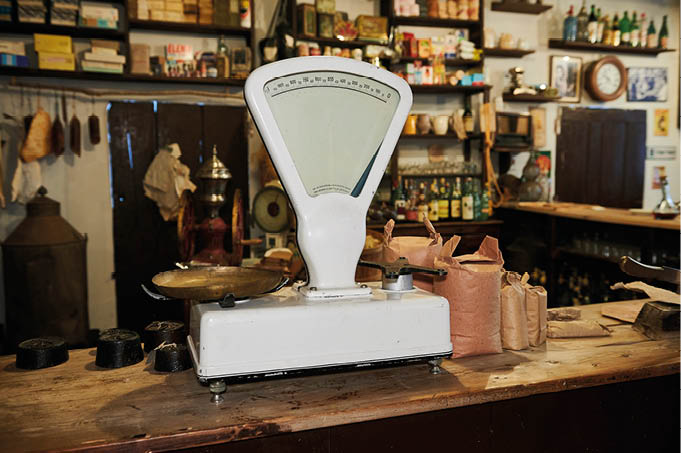detail of an old grocery store with an vintage style weight scale
