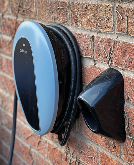 Leire, Lutterworth, UK. April 04 2022. A domestic car charging unit on an outdoor wall. 