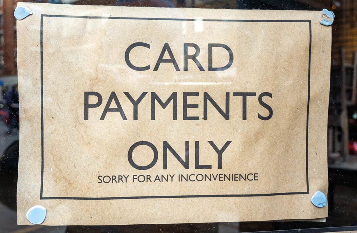A notice in a shop window informing customers it accept card payments only. A increasing trend as banks impose high charges for businesses banking cash.