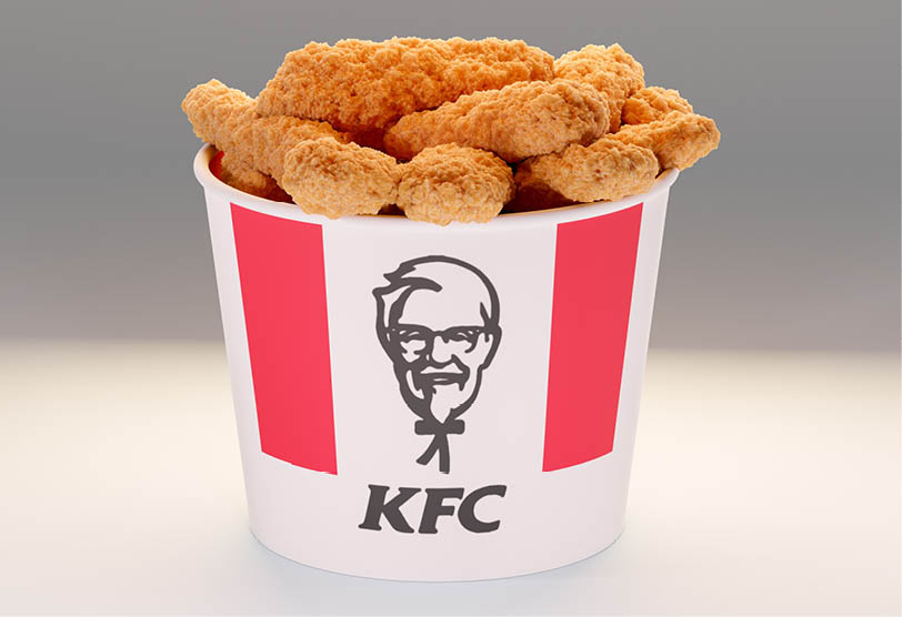 New York, USA - May 31, 2023: KFC basket. Lots of hot wings or strips of KFC chicken in KFC Kentucky Fried Chicken fast food bucket. KFC is an US fast food restaurant, specializes in fried chicken