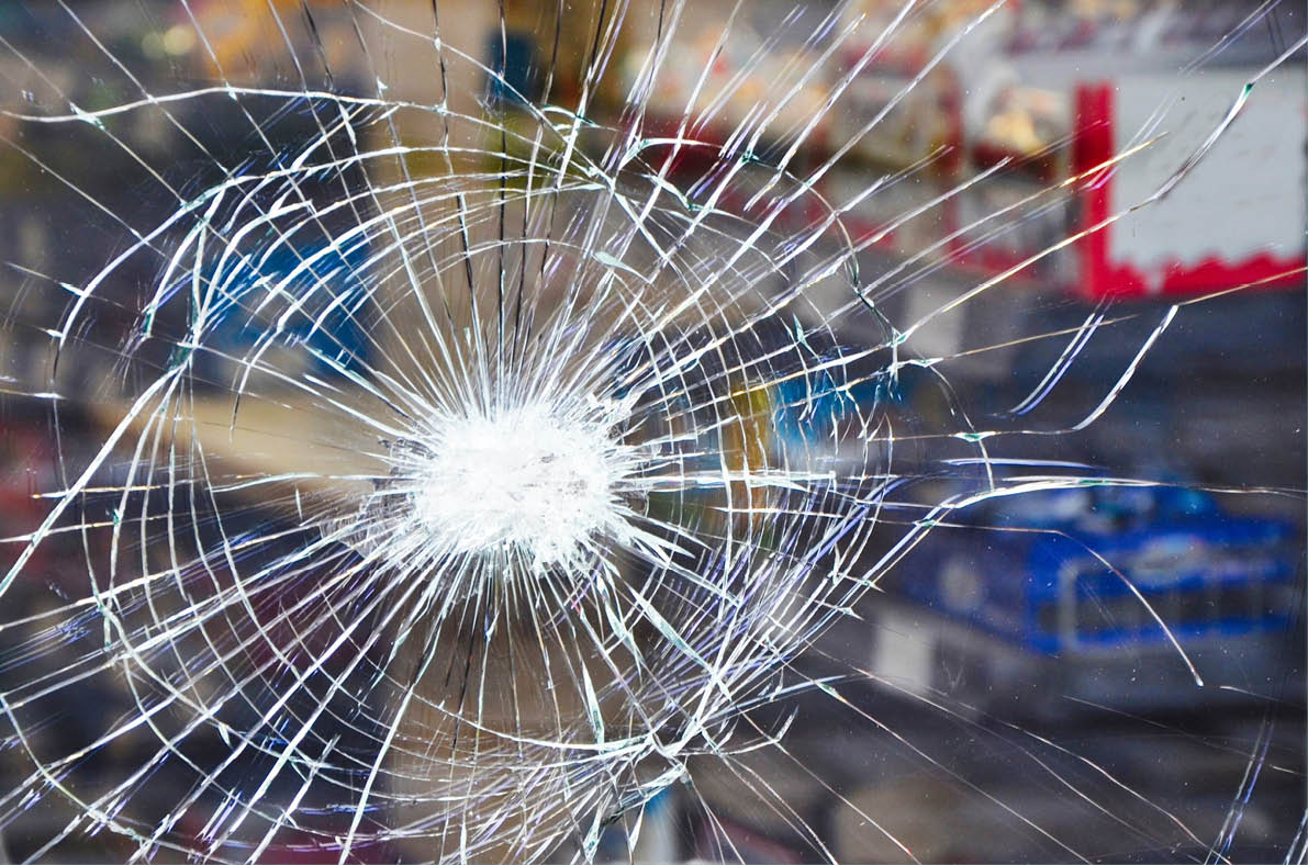 Shop window display with broken glass