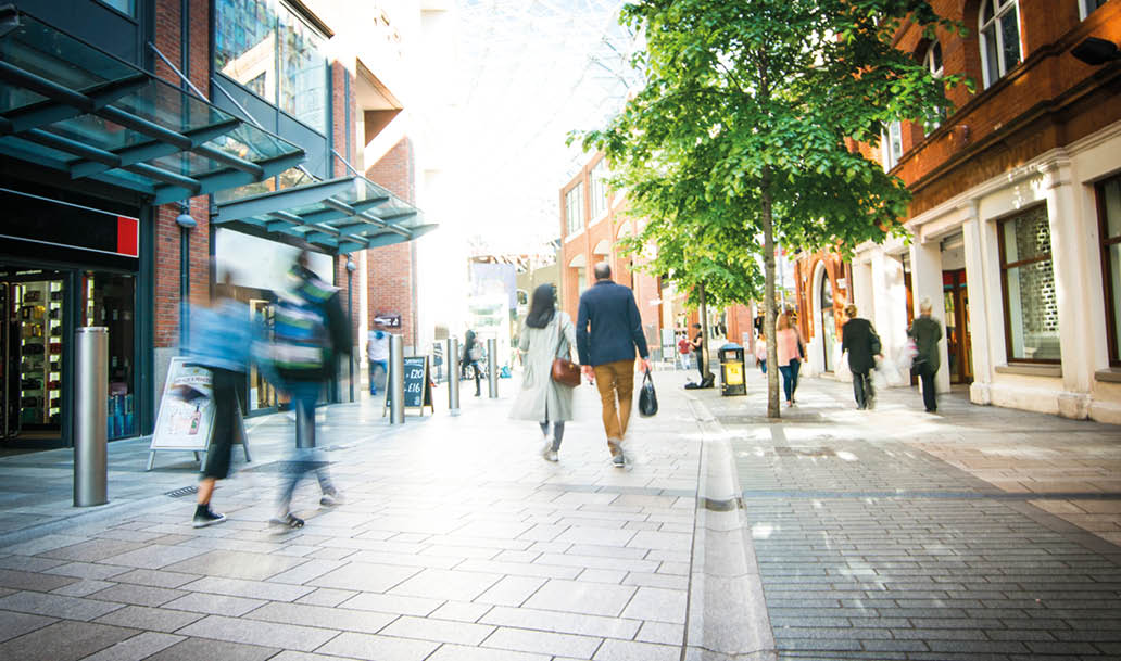 Anonymous shoppers walking on a shopping high street