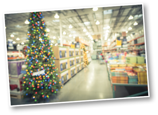 Blurred image huge Christmas tree decoration in wholesale store  Wreaths and strings of bokeh light surround the artificial Christmas tree  Christmas decorations for selling in America  Vintage filter