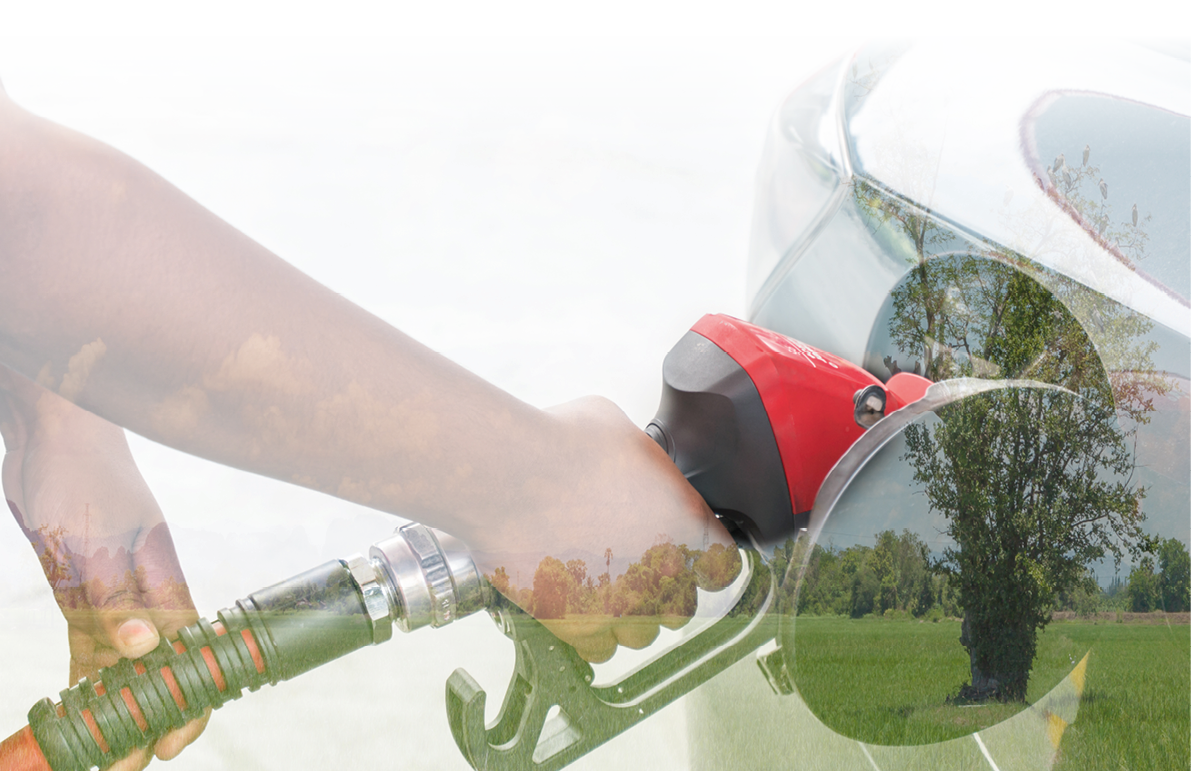 Double exposure hand refilling the car with fuel on a filling station and Green energy concept   