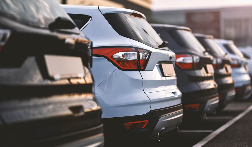 cars parked in row on outdoor parking