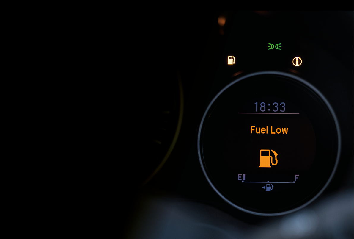 Close up empty Petrol, gasoline gauge dash board in car with digital warning sign of run out of fuel turn on on black background  Low level of fuel show on speedometer dashboard 