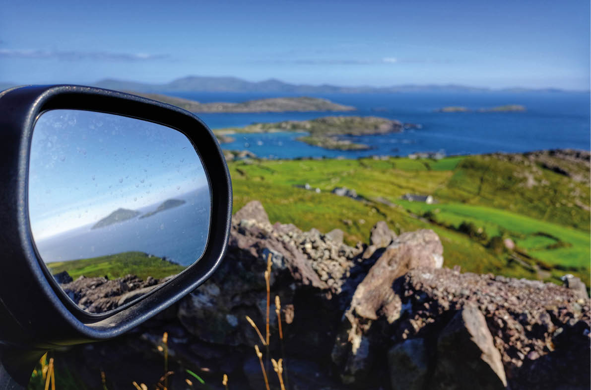 Stunning view of the Skelligs Islands through a car side mirror, County Kerry, Ireland 