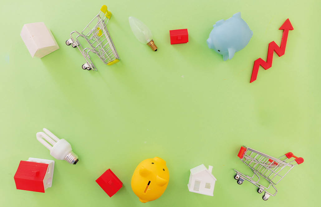 Living cost increase, economic crisis in 2023 flat lay. Shopping cart utilities bills and red rising up arrow on green background.