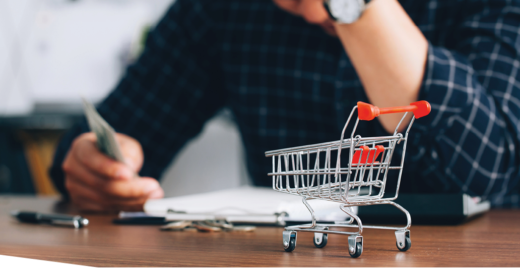 Man holding his forehead while having headache due to higher food prices from inflation.Rising food and grocery store prices and expensive daily consumer goods concept. The problem of inflation