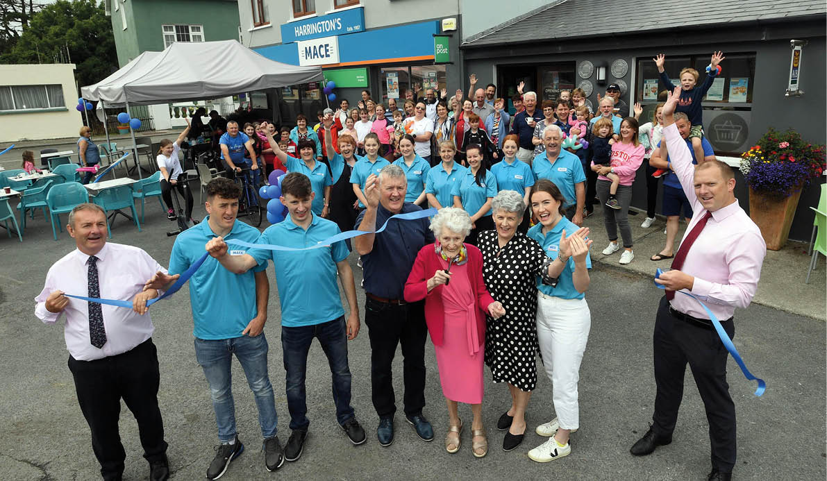 19-8-2022: 96 years old Mary Harrington, cuts the tape to officialy open the newly renovated Harrington's MACE Store in Ardgroom, West Cork on Friday surrounded by her family, daughter Noralene Harrington, son-in-law John Shea, grandchildren Micheal, Jack and Mary Kate Shea with Liam Attridge and Colin Brady from MACE. Photo: Don MacMonagle repro free photo from MACE