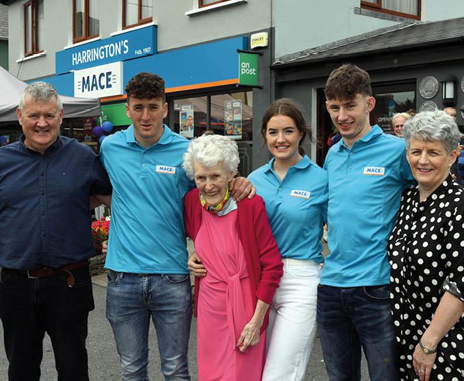 19-8-2022: 96 years old Mary Harrington, surrounded by her family, daughter Noralene Harrington, son-in-law John Shea, grandchildren Micheal, Jack and Mary Kate Shea after she cut the tape to officialy open the newly renovated Harrington's MACE Store in Ardgroom, West Cork on Friday. Photo: Don MacMonagle  repro free photo from MACE