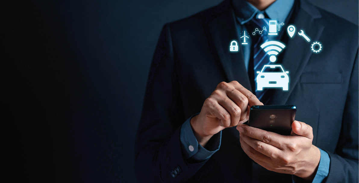 Businessman use smartphone control Intelligent car app eco system vehicle and smart cars with showing icon of the car and information about parking location, fuel, energy saving, service and security.