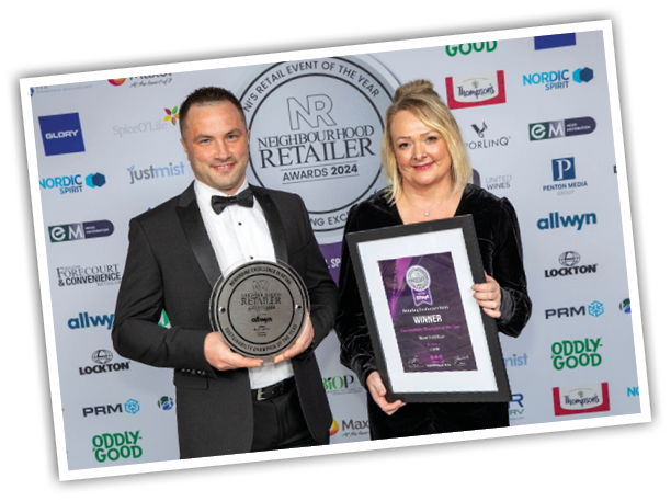 A person and person holding awards Description automatically generated