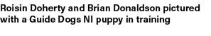 Roisin Doherty and Brian Donaldson pictured with a Guide Dogs NI puppy in training