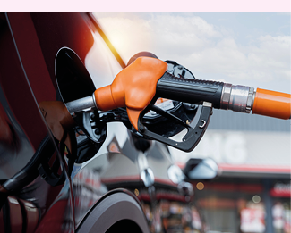 Transport and industry concept. Refilling the car. A refueling valve is inserted into the fuel filler neck. White car at gas station being filled with fuel. Car refueling at gas station.