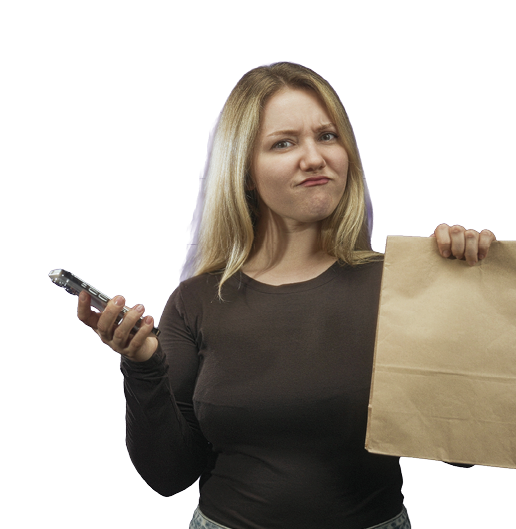 A person with long hair wearing a dark long-sleeve shirt holds a smartphone in one hand and a brown paper bag in the other while making a skeptical or displeased facial expression. Description generated by AI