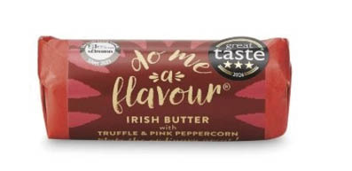 A wrapped block of Irish butter labeled “do me a flavour" with truffle and pink peppercorn flavor, featuring award stickers on the packaging. Description generated by AI