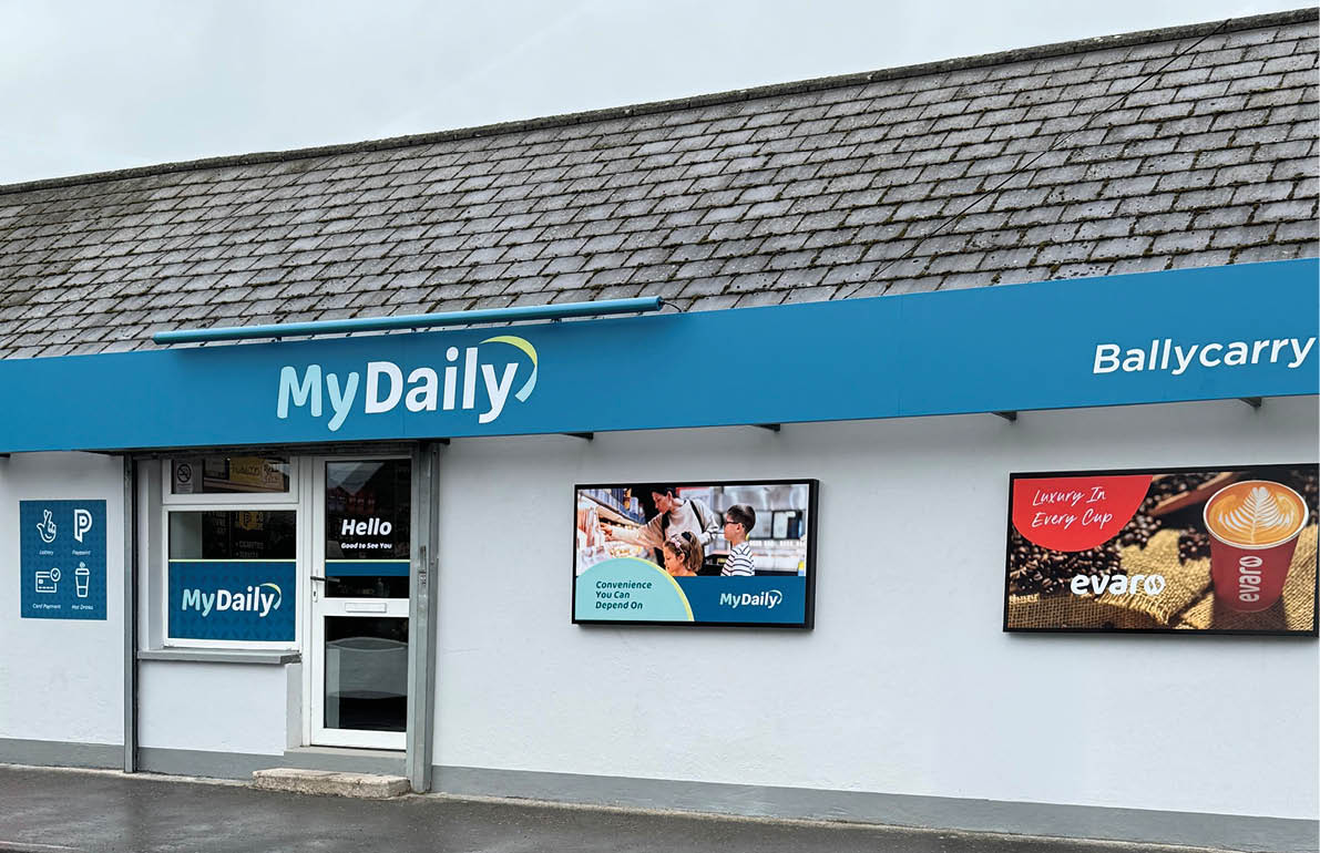 A storefront with a blue awning displaying the name MyDaily and a digital screen showing people shopping inside. Description generated by AI